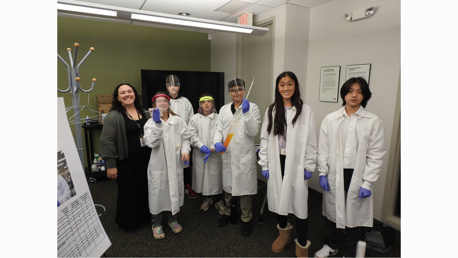 Children and teens suit up in lab coats during Take Our Daughters and Sons to Work Day at CSL.